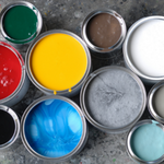 Overhead perspective of multiple colors of opened paint cans